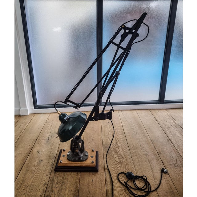 Large articulated lamp created from a 1920s drafting table pantograph, adjusted by adding a handwheel and a large antique...