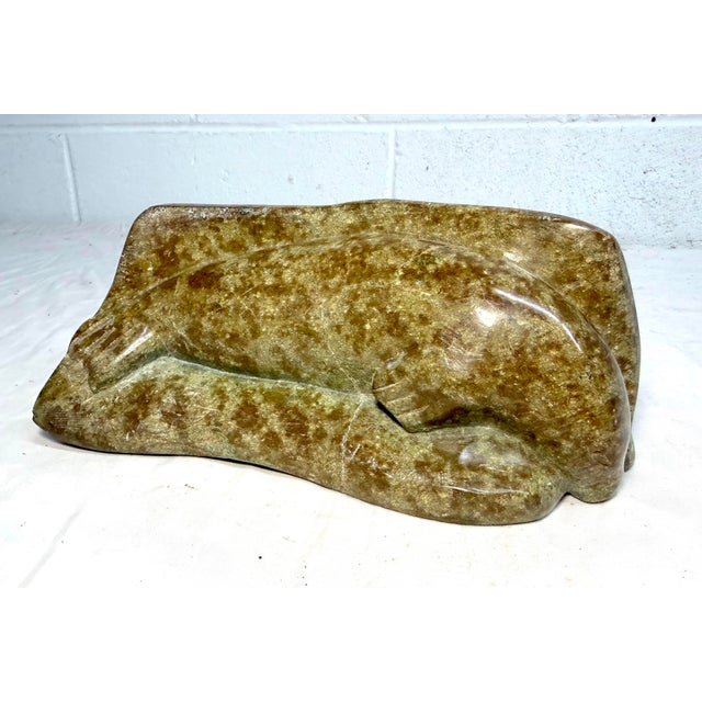 Up for sale is a high quality hand carved antique Canadian Inuit soapstone Eskimo sculpture by Eva Itulu. It's sculpted...