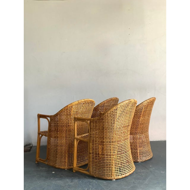 Embrace the relaxed elegance of coastal living with this exquisite set of four vintage woven rattan tub chairs. Crafted...