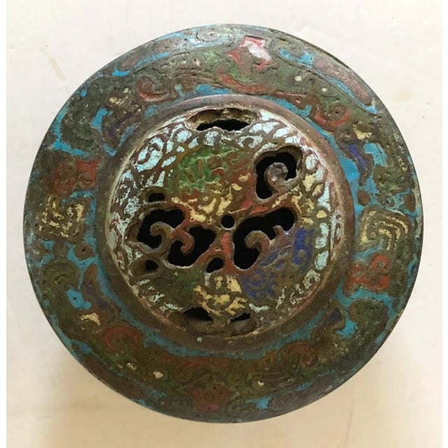 Beautiful bronze circular cloisonné incense burner decorated with blues, greens and red. Open work of removable lid.