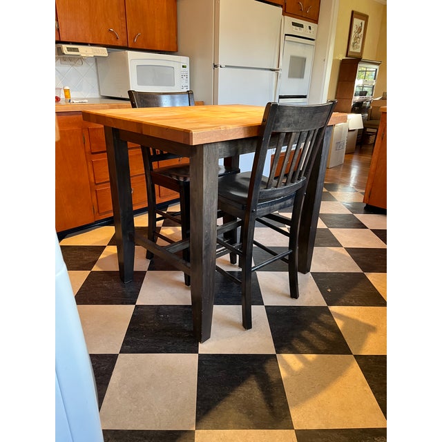 Custom made butcher block table, legs crafted to match chair style, table legs and chair stained black, butcher block gets...