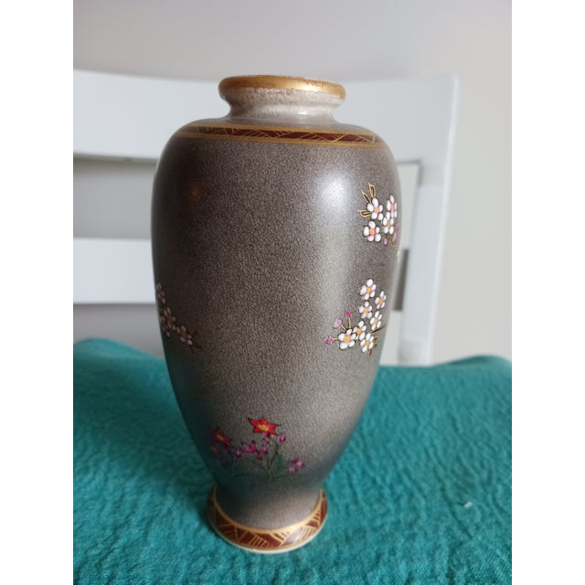 Fine Satsuma and enamel vase with birds and blossoms from the early 20th C. 6" high. The labels on the base are incomplete...