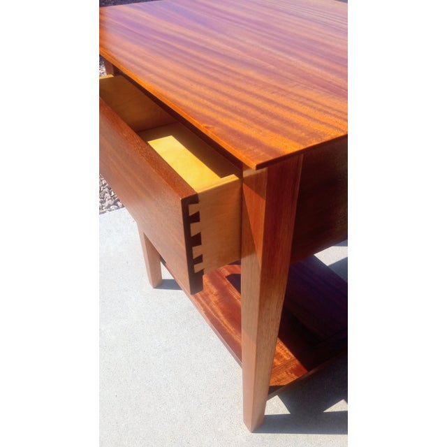 A striking, artisan-crafted pair of contemporary nightstands executed in premium, solid African Mahogany. Handcrafted by...