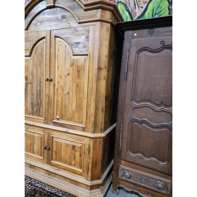 A large, statement-making rustic armoire crafted in solid pine with a beautifully varied, reclaimed-wood look. The cabinet...