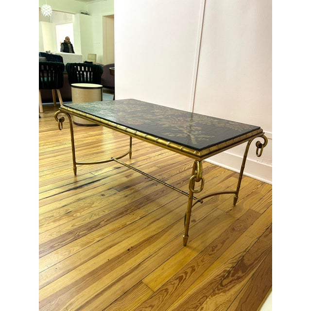 1980s La Barge Coffee Table. Beautiful hand painted floral top. Faux bamboo brass frame.