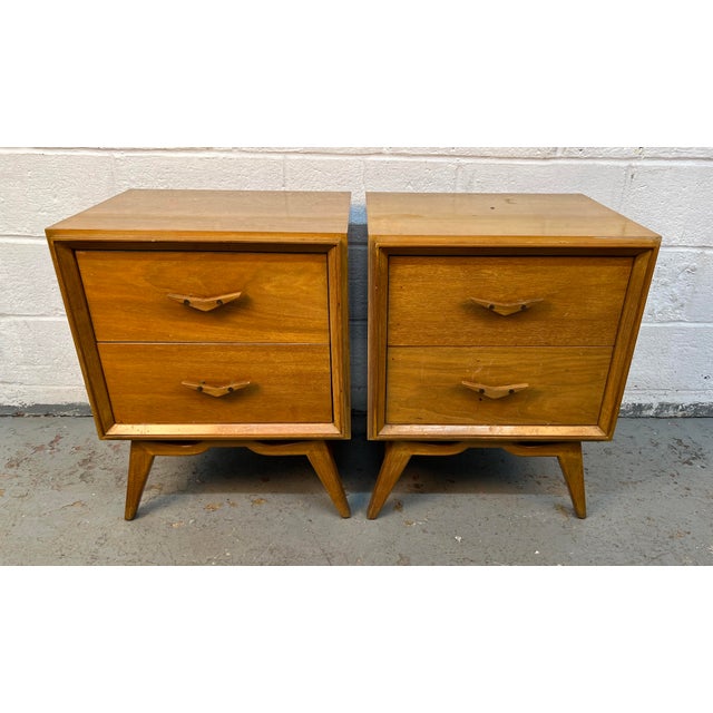 Add authentic retro character to your space with these unique mid-century modern nightstands featuring sculpted wood...