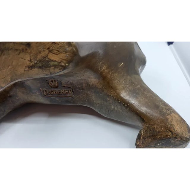 The sculpture of a polar bear, created by artist Pierre Chenet, is a 50 cm wide work in bronze. Pierre Chenet, who also...