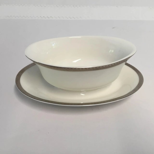 Elegant rare platinum rim with modern design under plate, one piece gravy boat, makers mark reads " Fine Ivory China NIKKO...