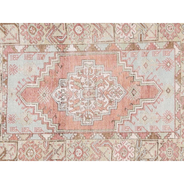 Elevate your space with this Vintage Turkish Oushak Rug. Measuring at 3'7" x 4'10", this rug boasts a traditional Oushak...