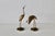 A pair of vintage mid-century modern brass crane sculptures with detailed feathering on the wings and a polished gold...