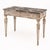 Pair of consoles from Italy featuring hand-carved floral friezes and tapered legs. The bases of the tables have a soft...