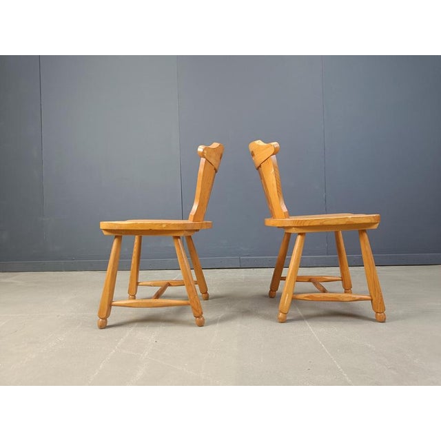 Rustic solid oak dining chairs with nicely crafted backrests and chuncky legs. Good original condition. 1960s - Germany...