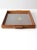 This is an early 20th century antique wood serving tray. The decorative tray has a glass top and features a hand-painted...