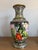 Large Chinese cloisonné enamel floor vase featuring a dramatic phoenix-and-floral design against a black background. The...