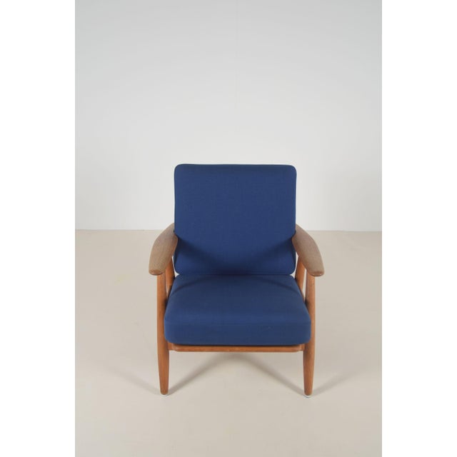 Danish ge240 cigar chair designed by top designer hans j. Wegner in 1955. The chair was manufactured by getama and bears...
