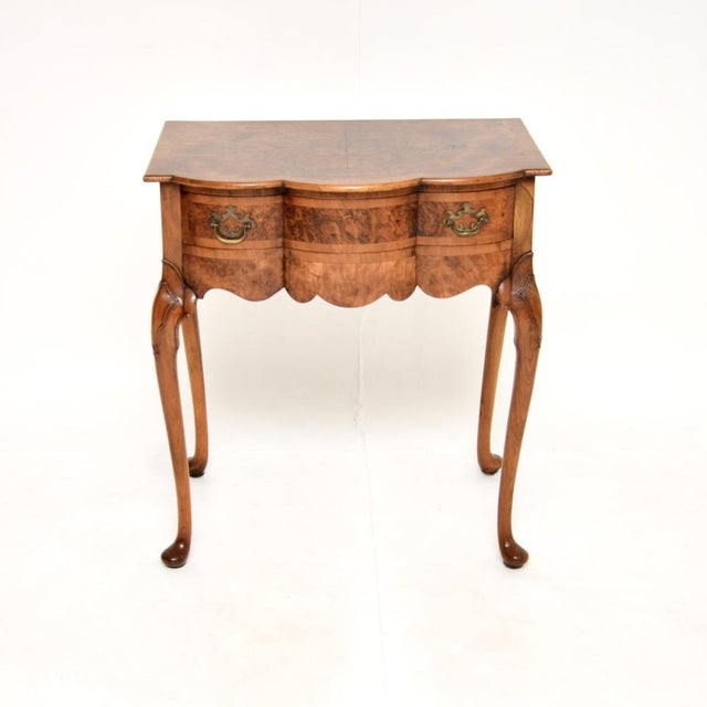 A beautiful and elegant antique burr walnut console / side table, made in England and dating from around the 1900-1910...