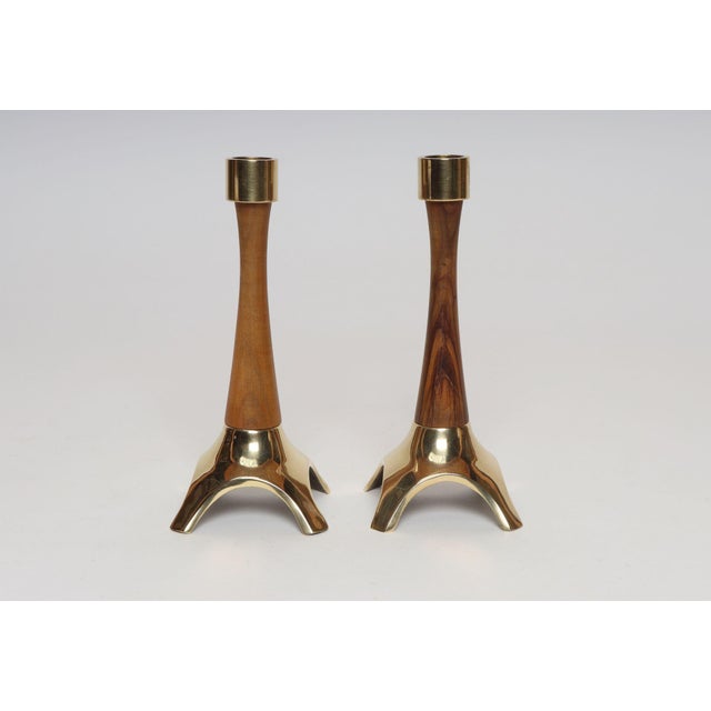Elegant, sculptural candlesticks with walnut stems and brass bases and sockets (ca. 1950s, Austria). An otherwise modest...