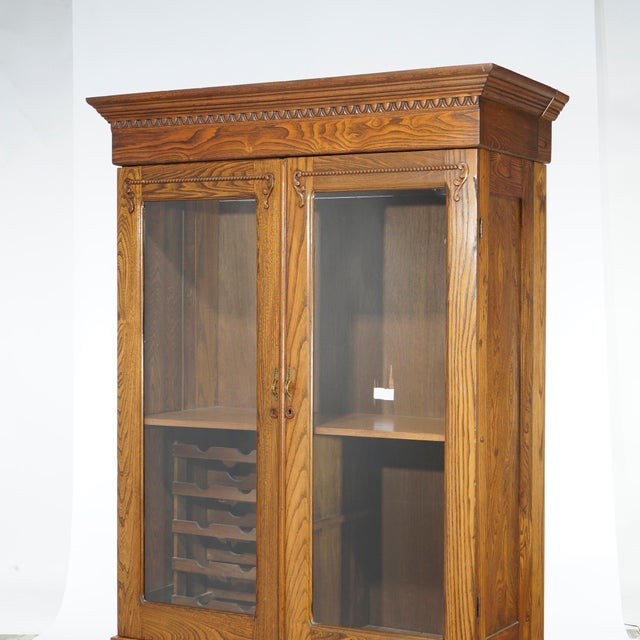 Wood Antique Carved Oak Double Door Bookcase with Wine Rack 1920 For Sale - Image 7 of 12