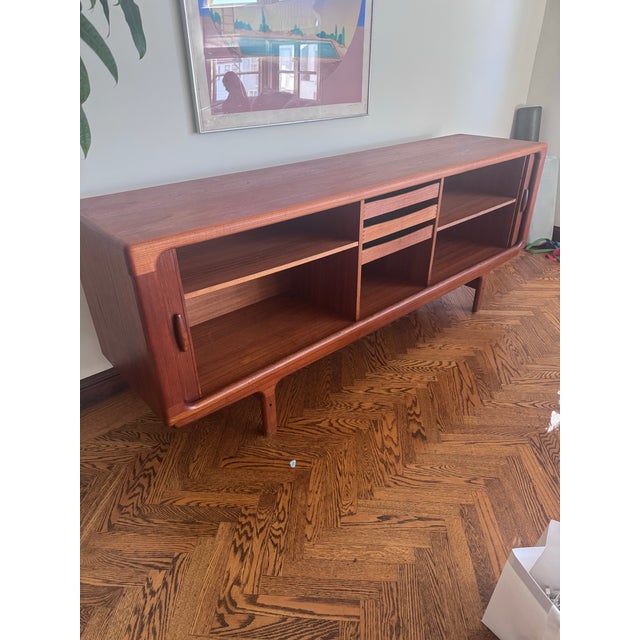 Danish Modern Teak Tambour Sideboard, c. 1960s–70s Classic Danish credenza in solid and veneered teak. Retractable tambour...