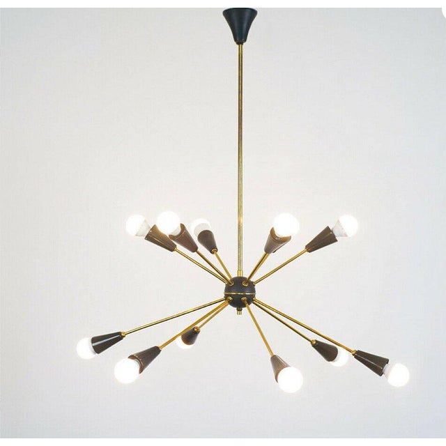 Sputnik Chandelier with 10 Lights - Brass and Matte Black Cones, Italy, 1960s : Refined Sputnik chandelier from the 1960s,...