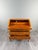 An elegant Louis XV style drop-front secretary desk, dating from the late 19th century. The desk features a richly...