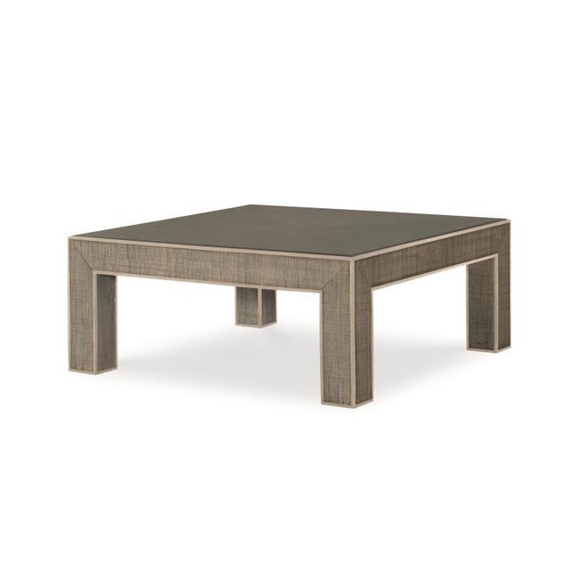 This piece is available only as shown, and will ship in 2-3 weeks. This modern parson style cocktail table is crafted of...