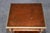 This exceptionally decorative pair of French Louis XVI and Directoire-style nightstands, executed in richly figured walnut...
