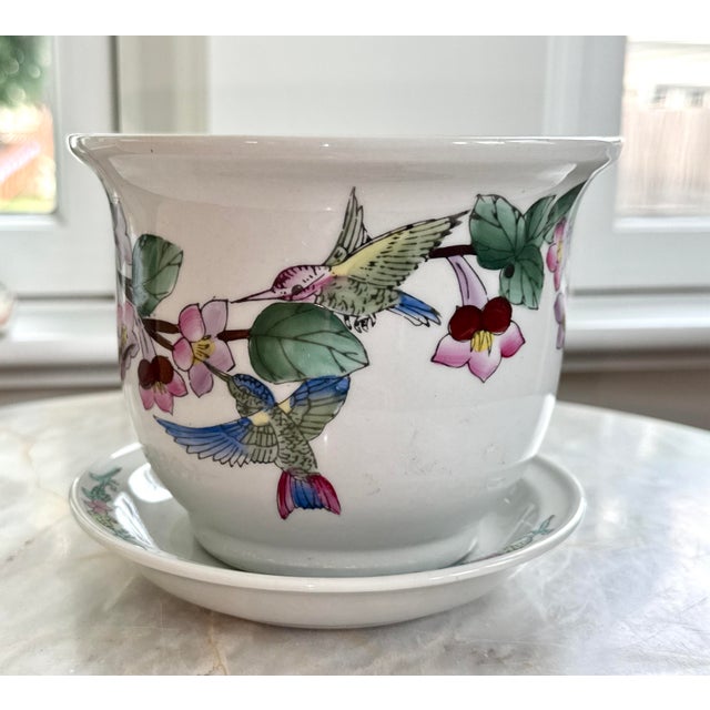 Very pretty, vibrant chinoiserie porcelain planter handpainted in China. Flowers and hummingbirds adorn this classic...