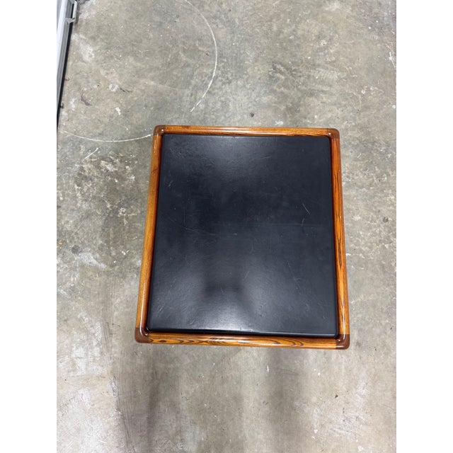 The Ward Bennett two-tier table is a classic mid-century modern piece with clean lines and a functional two-level design....