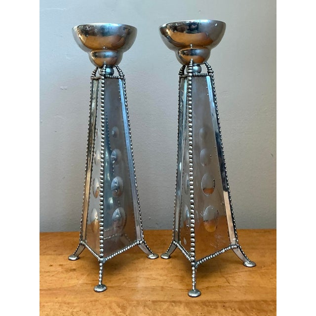 This striking pair of postmodern mirrored candlestick holders is a brilliant fusion of geometric precision and Hollywood...