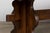 An early 20th-century French oak monastery trestle dining table, sourced in Lyon, France. Distinguished by its substantial...