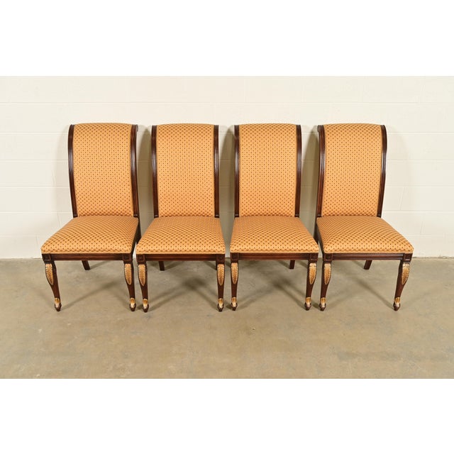 A gorgeous set of four Regency, Neoclassical, or Empire style dining chairs In the manner of Baker Furniture USA, Circa...