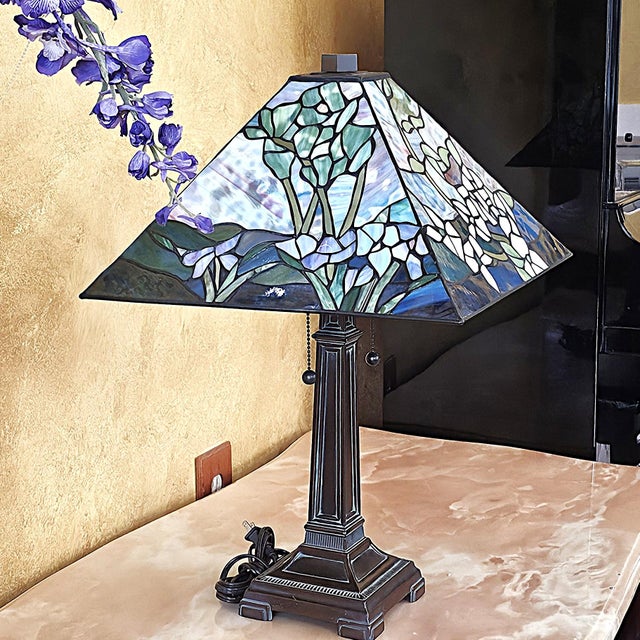 Distinctive 2003 Tiffany-style table lamp with a dramatic pyramid-shaped stained-glass shade featuring floral and...
