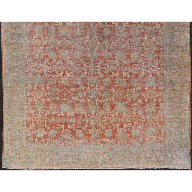 Measures: 8'9 x 12'4 Antique Persian Sultanabad Rug with Floral Soft Red Field and Pale Blue Border. Keivan Woven Arts/...