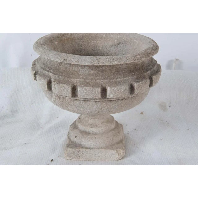 18th century carved stone French garden urn with large dental trim. This is not cast stone. One corner of the square base...