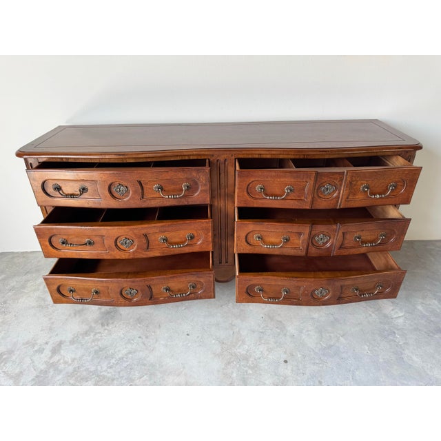 A stunning vintage Pierre Deux for Henredon dresser crafted in the elegant French Louis XV style. This finely made piece...