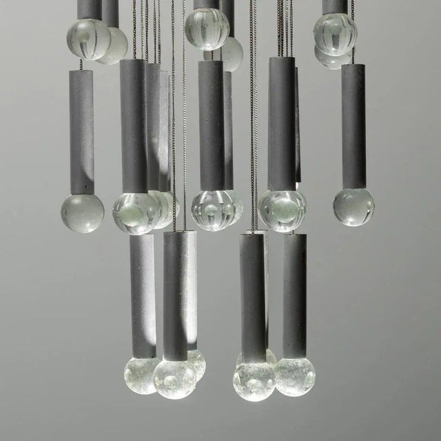 Bring iconic 1970s Italian glamour to your home with this stunning Mid-Century Modern chandelier. Characterized by a sleek...