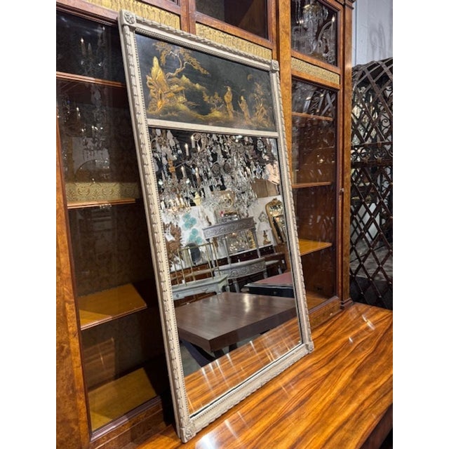 Unusual late 19th century French carved and painted trumeau mirror with chinoiserie panel. Very stunning in person and...