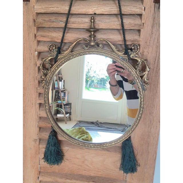 Succumb to the timeless charm of this delightful boudoir mirror, an authentic piece dating from the early 20th century....