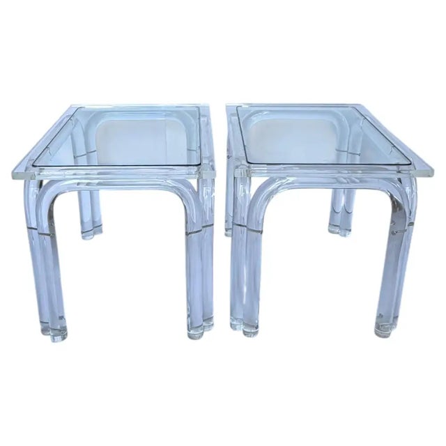 This pair of Mid-Century Modern rectangular Lucite cocktail tables captures the peak of Hollywood Regency glamour. Bold,...
