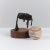 Bronze abstract sculpture on a wood plinth base by Palewic, 1981. The sculpture features a "rock" center surrounded by...