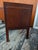 A pair of mid-century modern furniture pieces are walnut and slate-top nightstands Attributed to Jack Cartwright for...