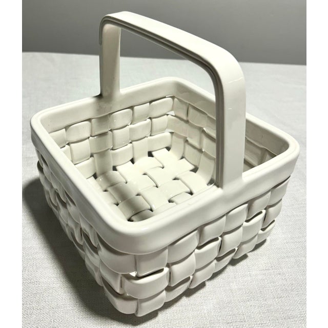 Textural and elegantly sculptural, this MCM Gump’s woven porcelain basket captures the illusion of natural wicker in...