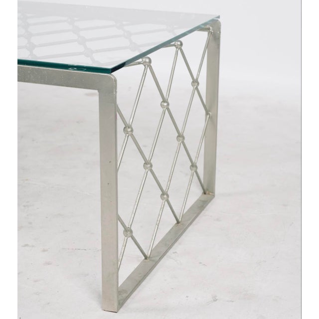Elegant Hollywood Regency coffee table featuring a nickel-plated metal frame with an airy geometric lattice design and...
