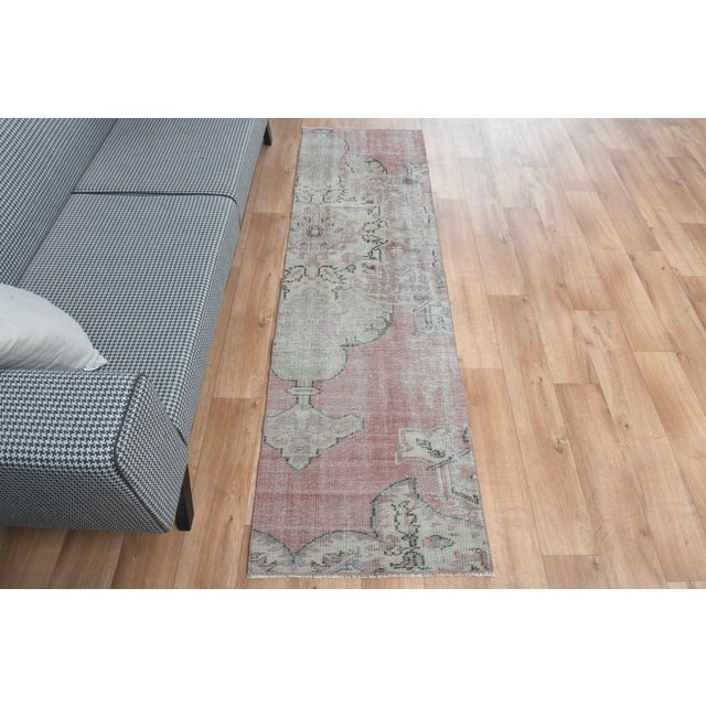 Vintage Hand-Knotted runner rug is a semi-antique vintage area rug. The '70s Eastern region of Anatolia's unique rug is...