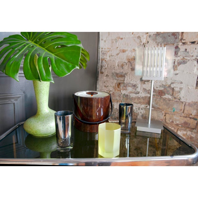 Dopamine Decor! Set of four postmodern frosted yellow drinking glasses with a hexagonal shape and faceted design. The...