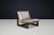 A sculptural leather sling lounge chair by Dreipunkt International, Germany, dating from the 1970s. Combining a dark...
