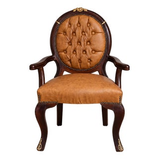 French Empire Style Cognac Leather Armchair With Deep Tufting and Ornate Black & Gold Frame For Sale