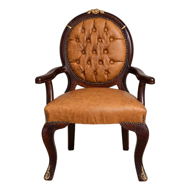 French Empire Style Cognac Leather Armchair With Deep Tufting and Ornate Black & Gold Frame For Sale