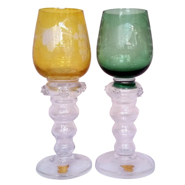 Set of two hand-blown Mid-century wine goblets from the Gullaskruf Glassworks in Sweden. Each goblet features an etched...